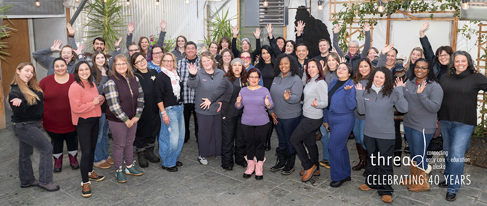 A group photo of the staff at thread celebrating their 40 years.